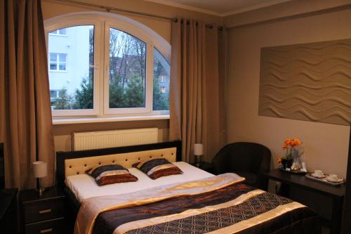 Łóżko lub łóżka w pokoju w obiekcie Villa Lido