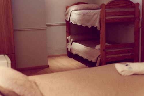 a bedroom with two bunk beds in a room at San Rafael Group Hotel in San Rafael