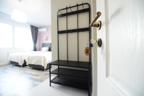 a room with a bedroom with a bed and a door at Skopje Arch Residence in Skopje