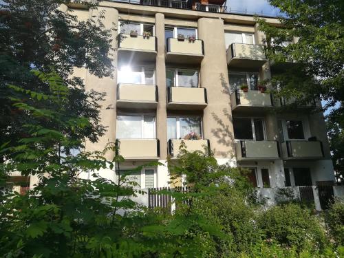 an apartment building with balconies on the side of it at Apartment Vilnius Zemaitijos in Vilnius