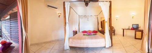 Postel nebo postele na pokoji v ubytování Hotel Laguna del Cocodrilo