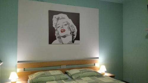 Postel nebo postele na pokoji v ubytování Manhattan Penzion