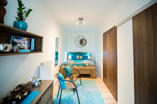 a bedroom with a bed and a desk and chairs at Nice Home to stay at Prague close to Castle with Terrace and Garden in Prague