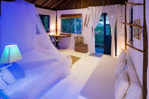 Voodi või voodid majutusasutuse Eco-Pousada Casa Bobô toas