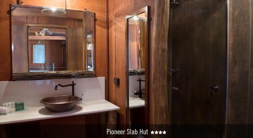 a bathroom with a bowl sink and a shower at Saltbush Retreat in Longreach