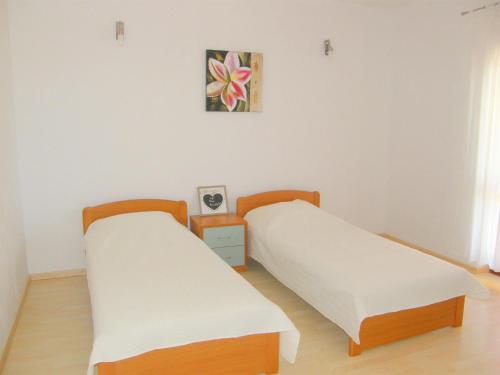 Кровать или кровати в номере Apartments Rina