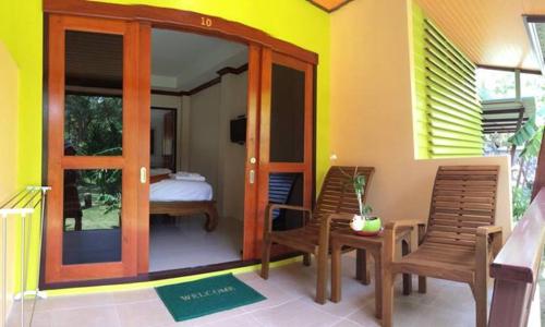 Ένα ή περισσότερα κρεβάτια σε δωμάτιο στο Green Villa