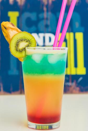 a kiwi drink with a slice of kiwi and pink straw at Two Seasons Boutique Hotel Baku in Baku
