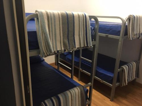 a couple of bunk beds in a room at Albergue Santiago Apostol in Logroño