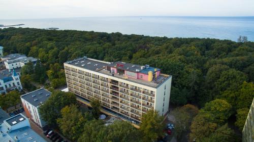 an overhead view of a building with trees and water at Centrum Zdrowia i Wypoczynku Ikar in Kołobrzeg