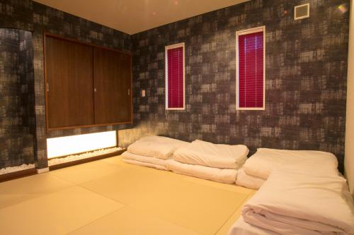 Tempat tidur dalam kamar di Villa Yushin