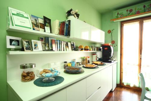 a kitchen counter with plates of food on it at B&B Francesco in Assisi in Assisi