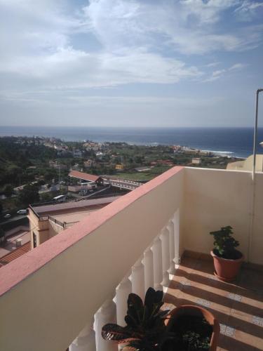 a balcony with a view of the ocean at Casa Cira in Calera