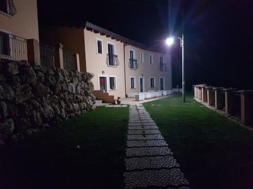 a street light next to a building at night at Borgo Donna Teresa in Castel San Vincenzo