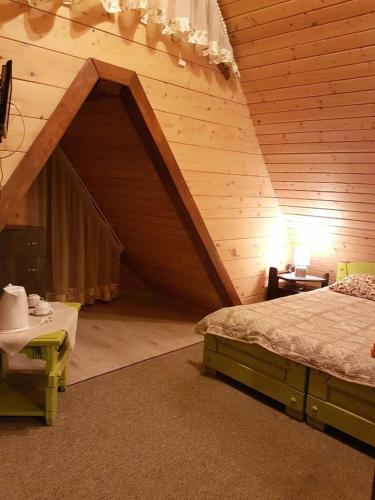 Postel nebo postele na pokoji v ubytování Tsarynka Eco Complex