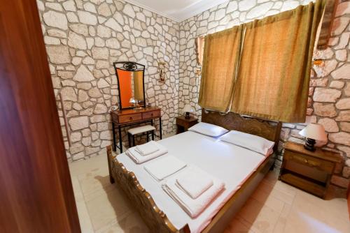 Postel nebo postele na pokoji v ubytování Luxury Stone Apartments
