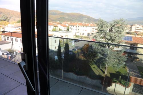 a view of a city from a window at Donati Business Rooms in Subbiano