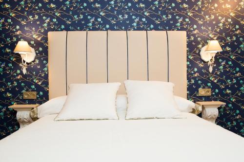 Postel nebo postele na pokoji v ubytování Hotel Hierbaluisa