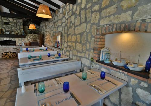 a room with a row of sinks in a stone wall at Club Residence at BlackSeaRama Golf in Balchik