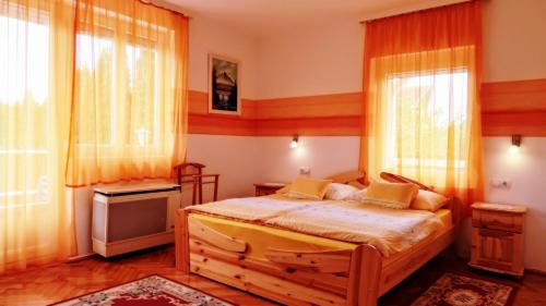 Postel nebo postele na pokoji v ubytování Magyar Apartmanház IV.