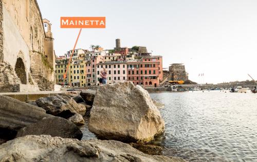 a sign that reads marina next to a body of water at Mainetta Sea View Apartment with AC in Vernazza