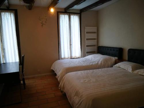 Ένα ή περισσότερα κρεβάτια σε δωμάτιο στο chambre noisy