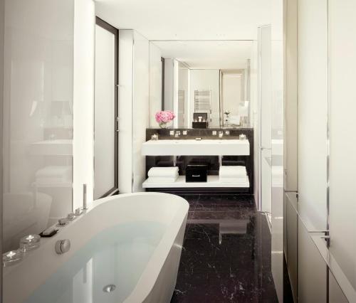 a bathroom with a sink and a bathtub at ME London by Melia in London