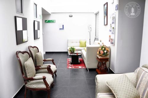 Χώρος καθιστικού στο Hotel Parque Santander Tunja