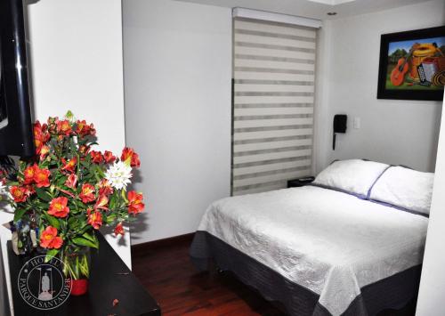 Ένα ή περισσότερα κρεβάτια σε δωμάτιο στο Hotel Parque Santander Tunja