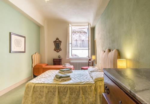 Ένα ή περισσότερα κρεβάτια σε δωμάτιο στο La Delizia Central Apartment
