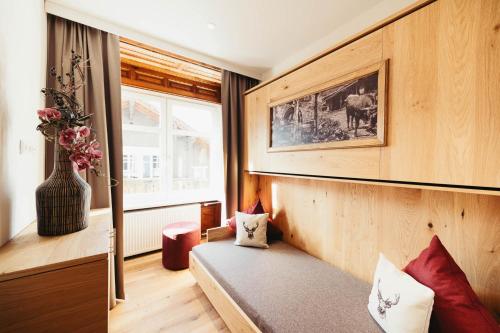 Posteľ alebo postele v izbe v ubytovaní adler alpen apartments