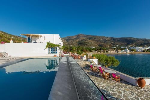 a view of the pool of a hotel and the water at Platys Gialos Hotel Sifnos in Platis Yialos Sifnos