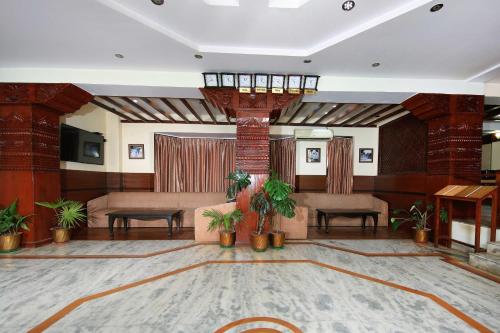 a lobby with a waiting area with a couch and a table at Samsara Boutique Hotel in Kathmandu