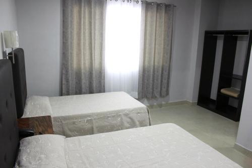 Ein Bett oder Betten in einem Zimmer der Unterkunft Hotel Tampico Express