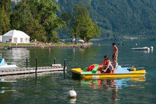 a group of people on a raft in the water at Altogold Swiss Holidays At Manor Farm 5* in Interlaken