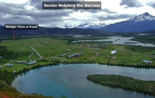 an aerial view of a lake with mountains in the background at Vista al Paine - Refugio de Aventura in Torres del Paine