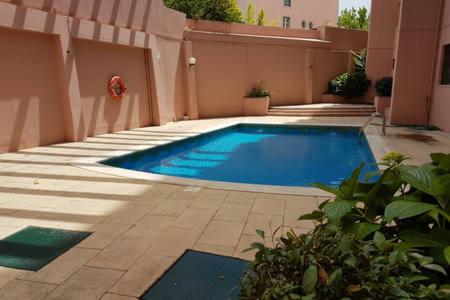 a swimming pool in the middle of a building at New Loft - Lisboa Estrela in Lisbon