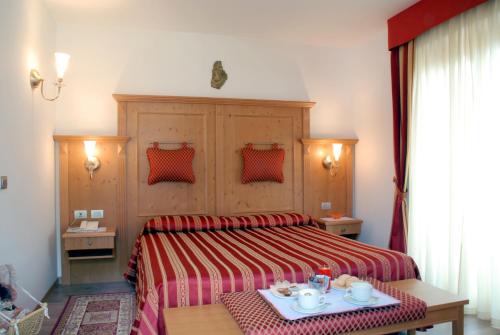 Postel nebo postele na pokoji v ubytování Hotel Sass Maor