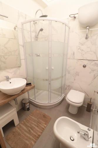 a bathroom with a shower and a toilet and a sink at B&B Pietrarsa in Portici