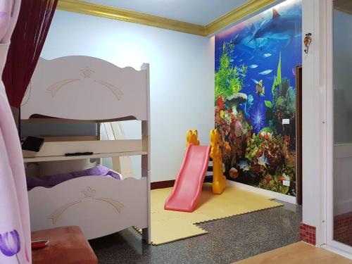 Postel nebo postele na pokoji v ubytování Shuanghu Garden B&B