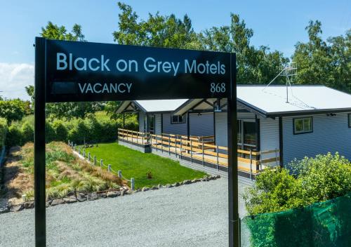 a sign that reads black on grey moles vicarary at Black on Grey in Geraldine