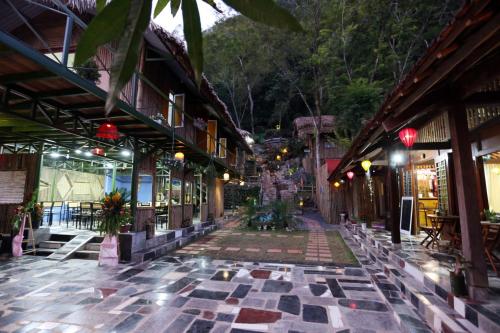 an empty street in an asian town at night at Green Hill Hostel & Tour in Ha Giang
