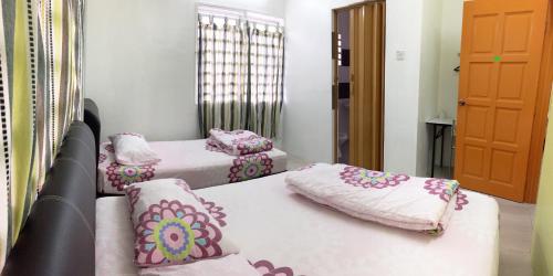 Katil atau katil-katil dalam bilik di Ipoh TZY's Homestay