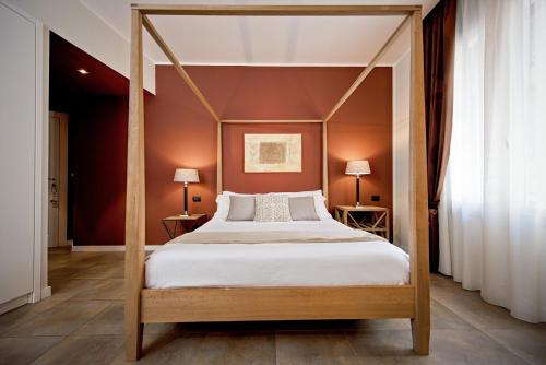 Delle Vittorie Luxury Rooms&Suitesにあるベッド
