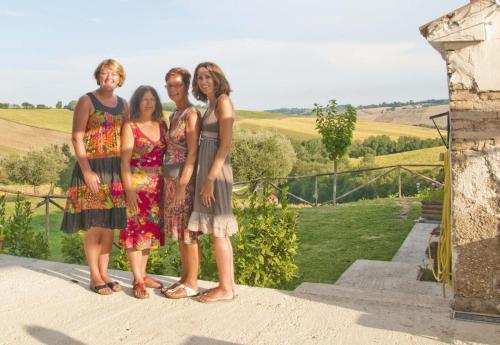 a group of four women posing for a picture at Tenuta Tredici Ulivi in Senigallia