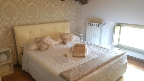 a bedroom with a bed with a purse on it at Donizetti Royal in Bergamo