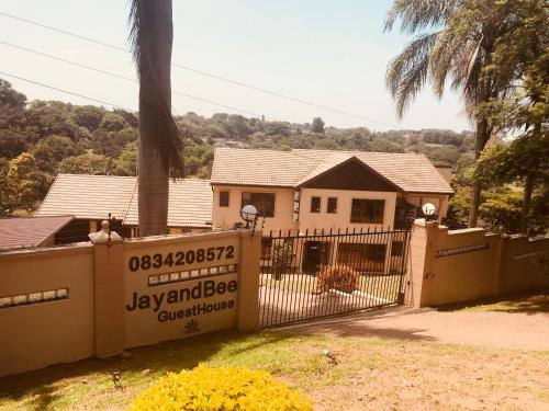 a house with a gate in front of it at Jay and Bee Guesthouse in Durban