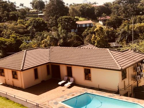 an aerial view of a house with a swimming pool at Jay and Bee Guesthouse in Durban