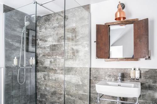 a bathroom with a sink and a shower at The Beaumont Hexham in Hexham
