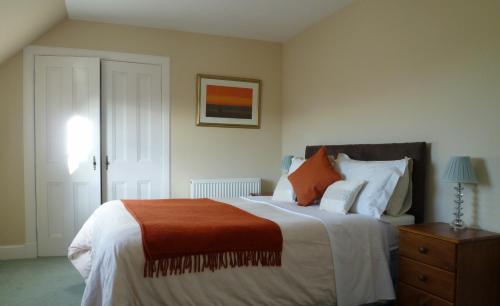 Ένα ή περισσότερα κρεβάτια σε δωμάτιο στο Dunallan Guest House